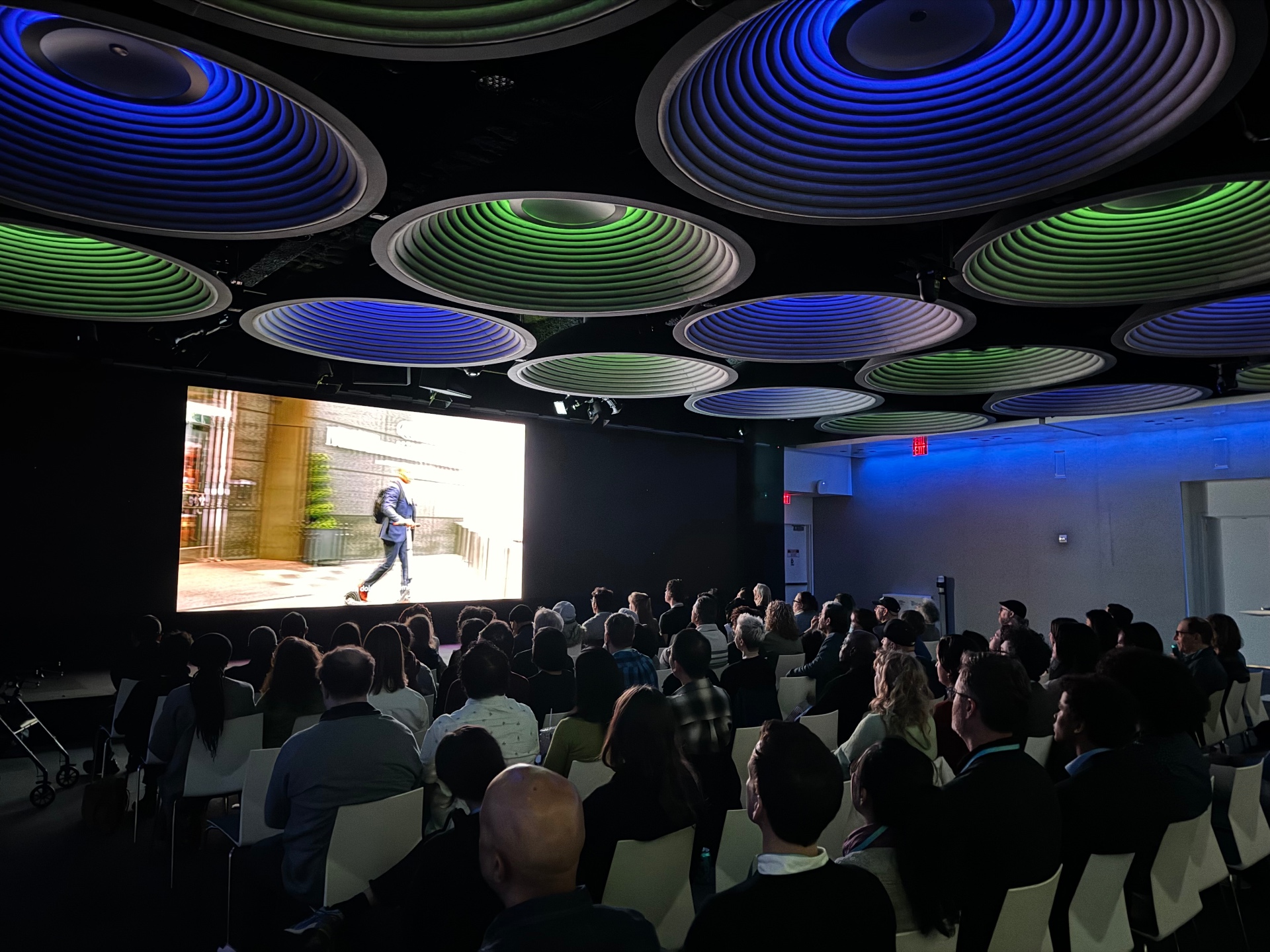 Sold-out audience watches a documentary on the main screen at Bloomberg Green Docs.