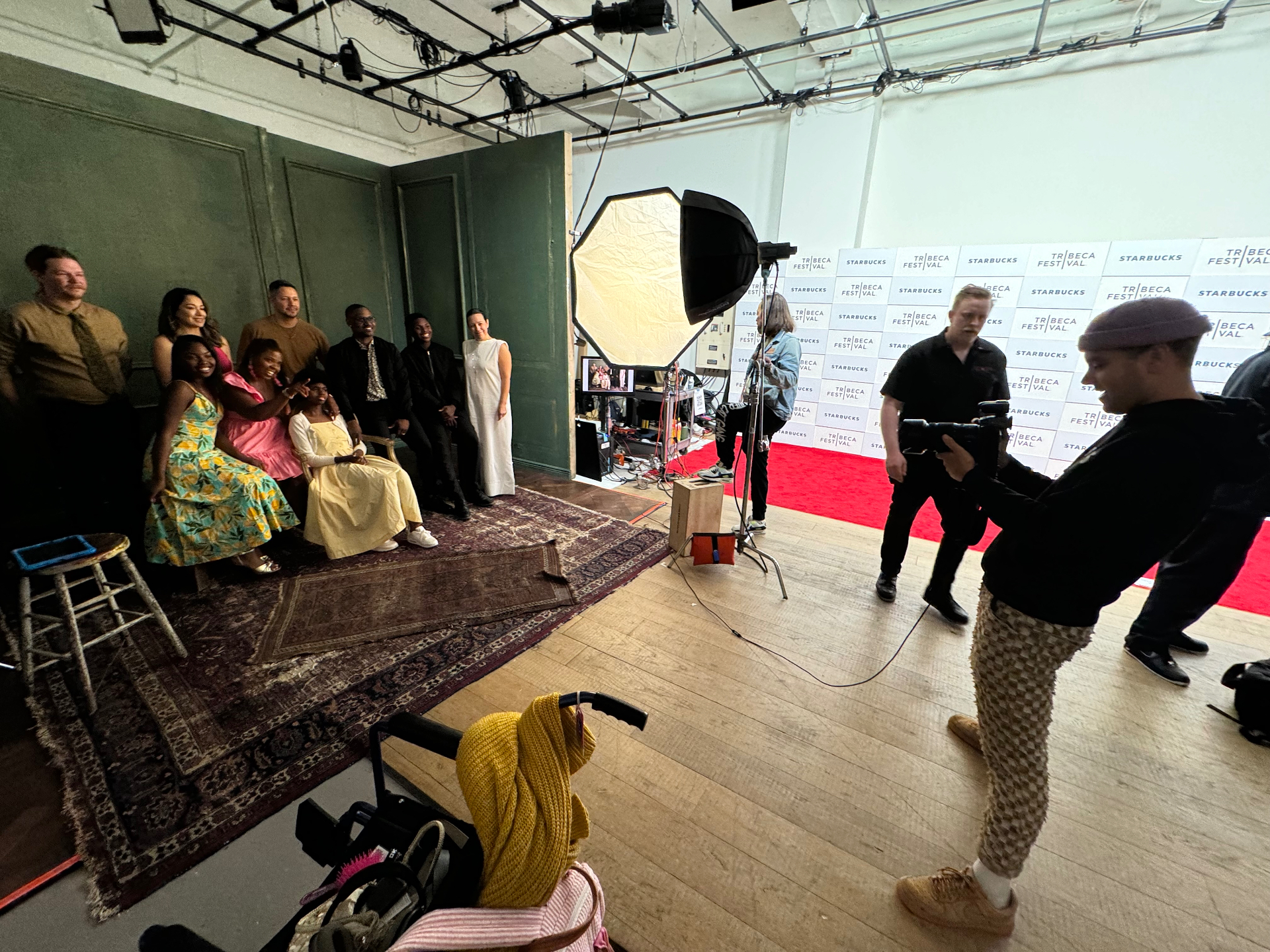 Talent group portrait session inside a branded Tribeca Festival x Starbucks studio.
