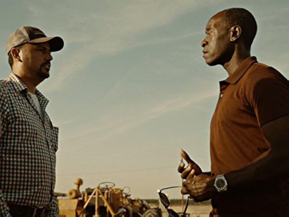 Don Cheadle interviewing a Texas farmer about drought