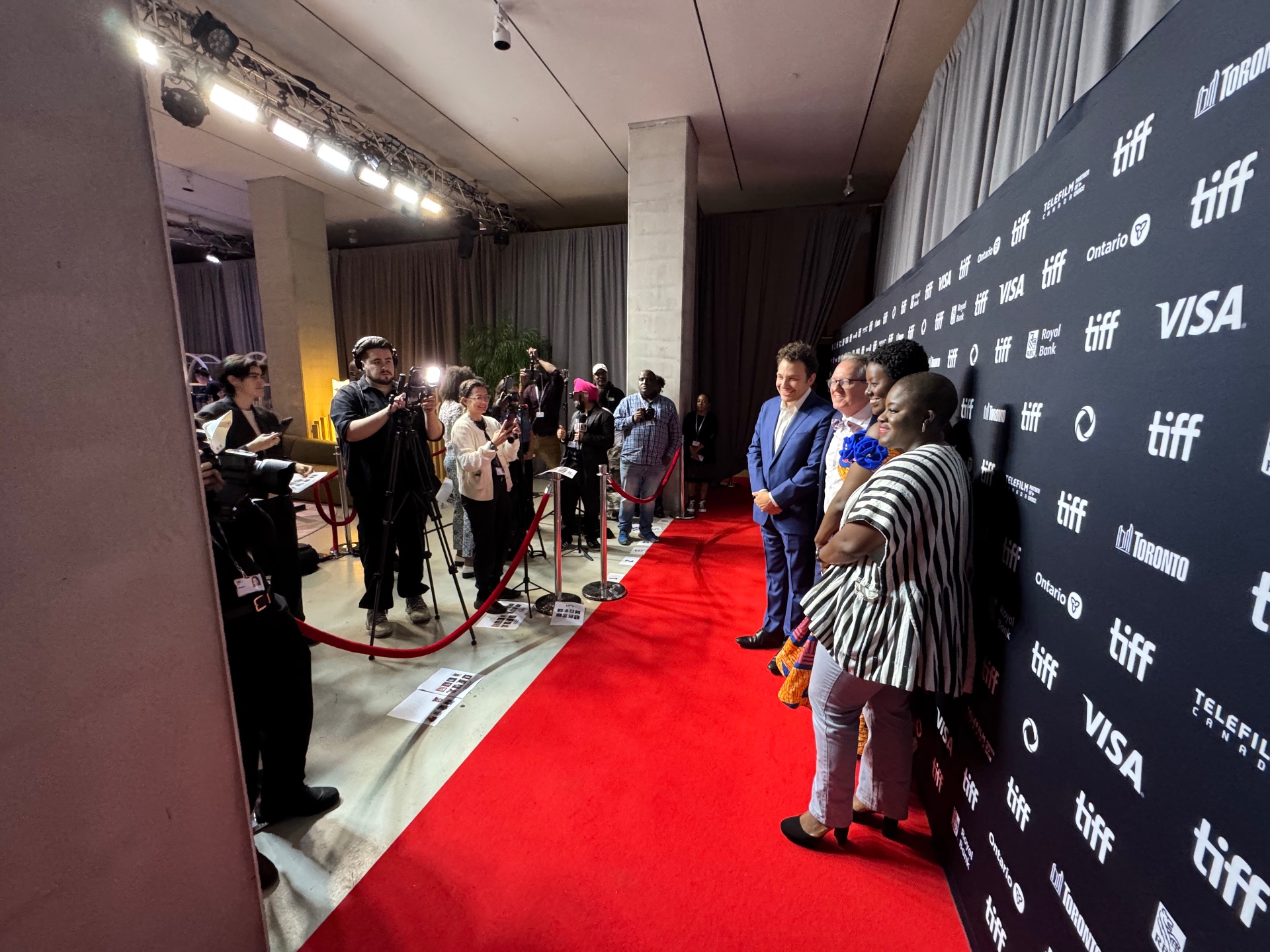 Agency client filmmakers pose for press photographers on the TIFF red carpet.
