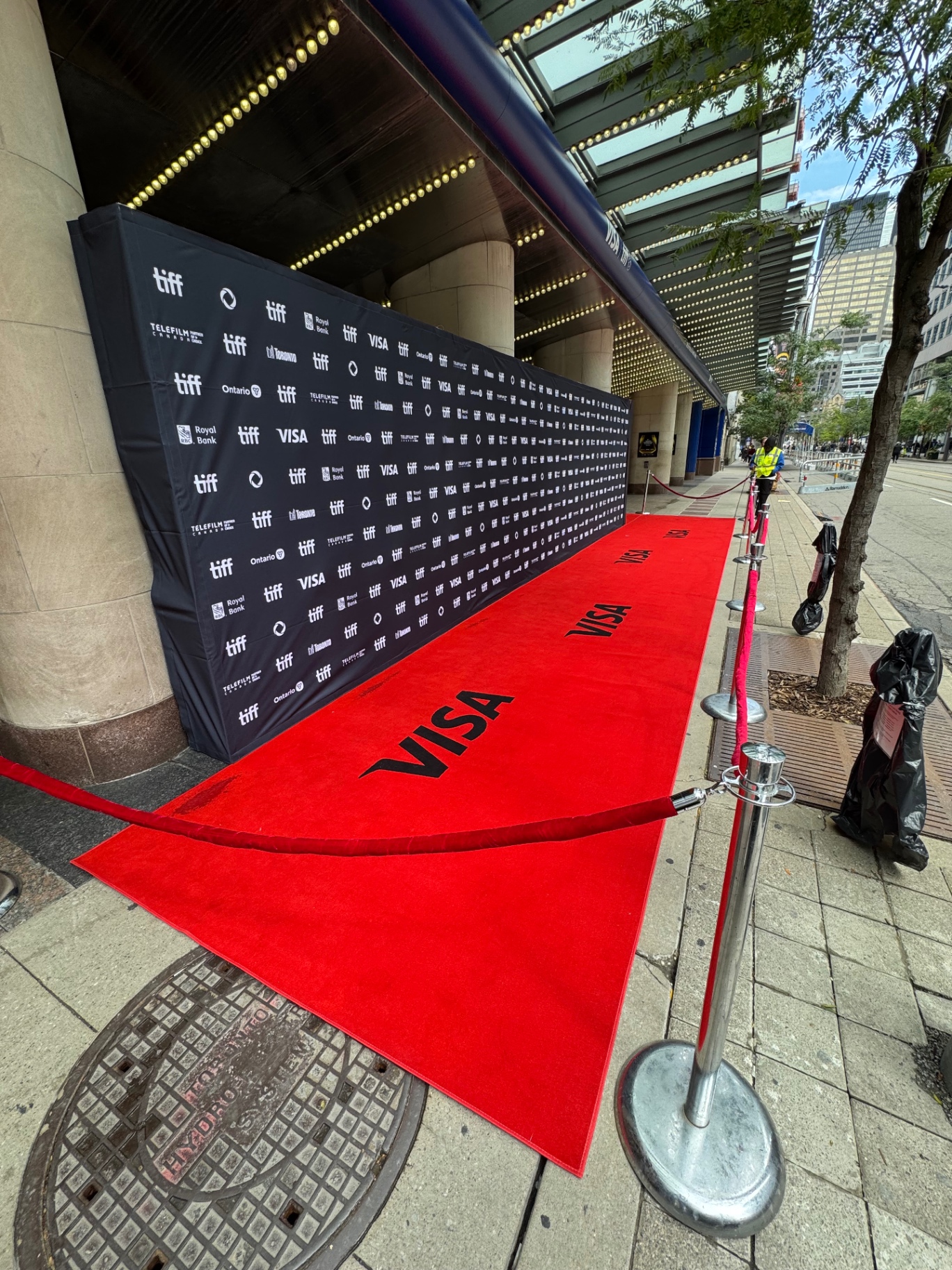 Empty TIFF red carpet and sponsor step-and-repeat ready for arrivals.