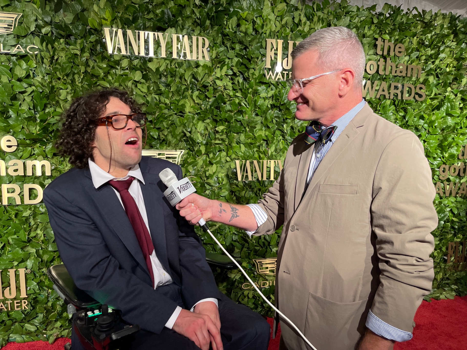 Client interviewed by Variety on the Gotham Awards red carpet in front of the Vanity Fair and FIJI Water hedge wall