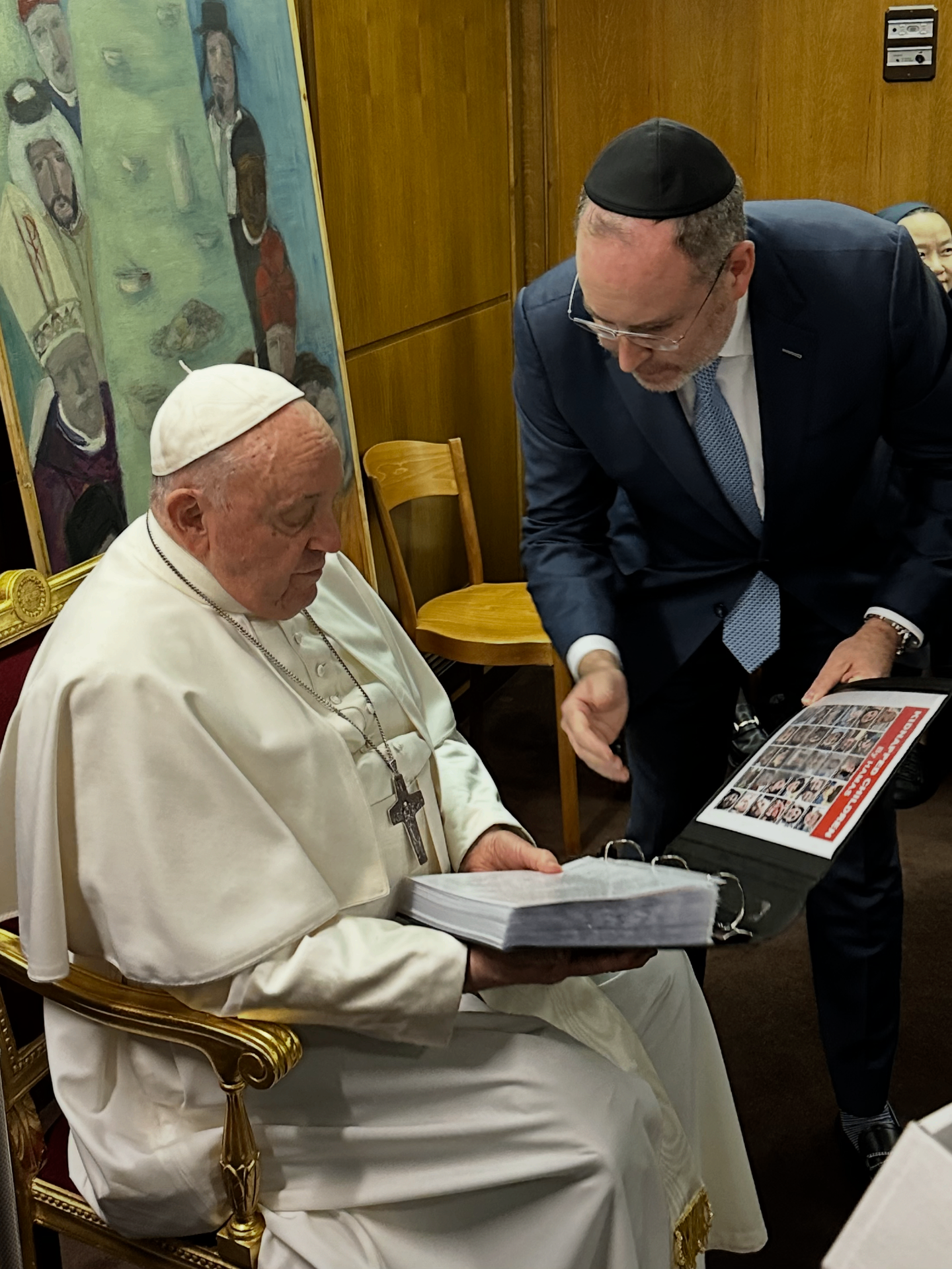 Adam J. Segal presents the book of kidnapped Israeli children to Pope Francis at the Vatican